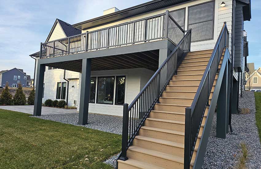 Dark painted steel-reinforced columns with modern deck design and composite stairs