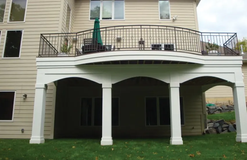 Multiple white square columns supporting large elevated deck area