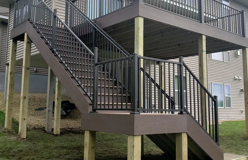 Switchback deck stairs with landing platform and composite decking materials