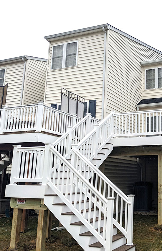 Townhome deck with stairs and entry landing