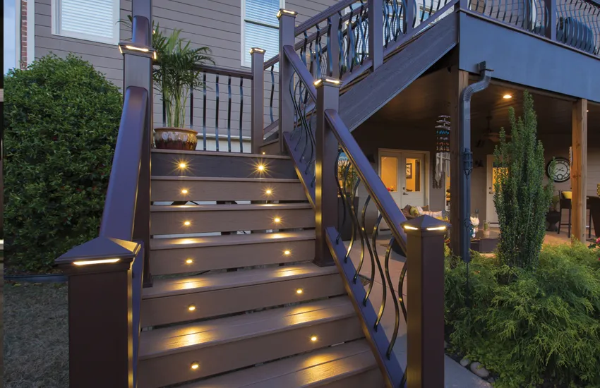 Bronze ornamental railing with integrated LED post lights on two-story deck