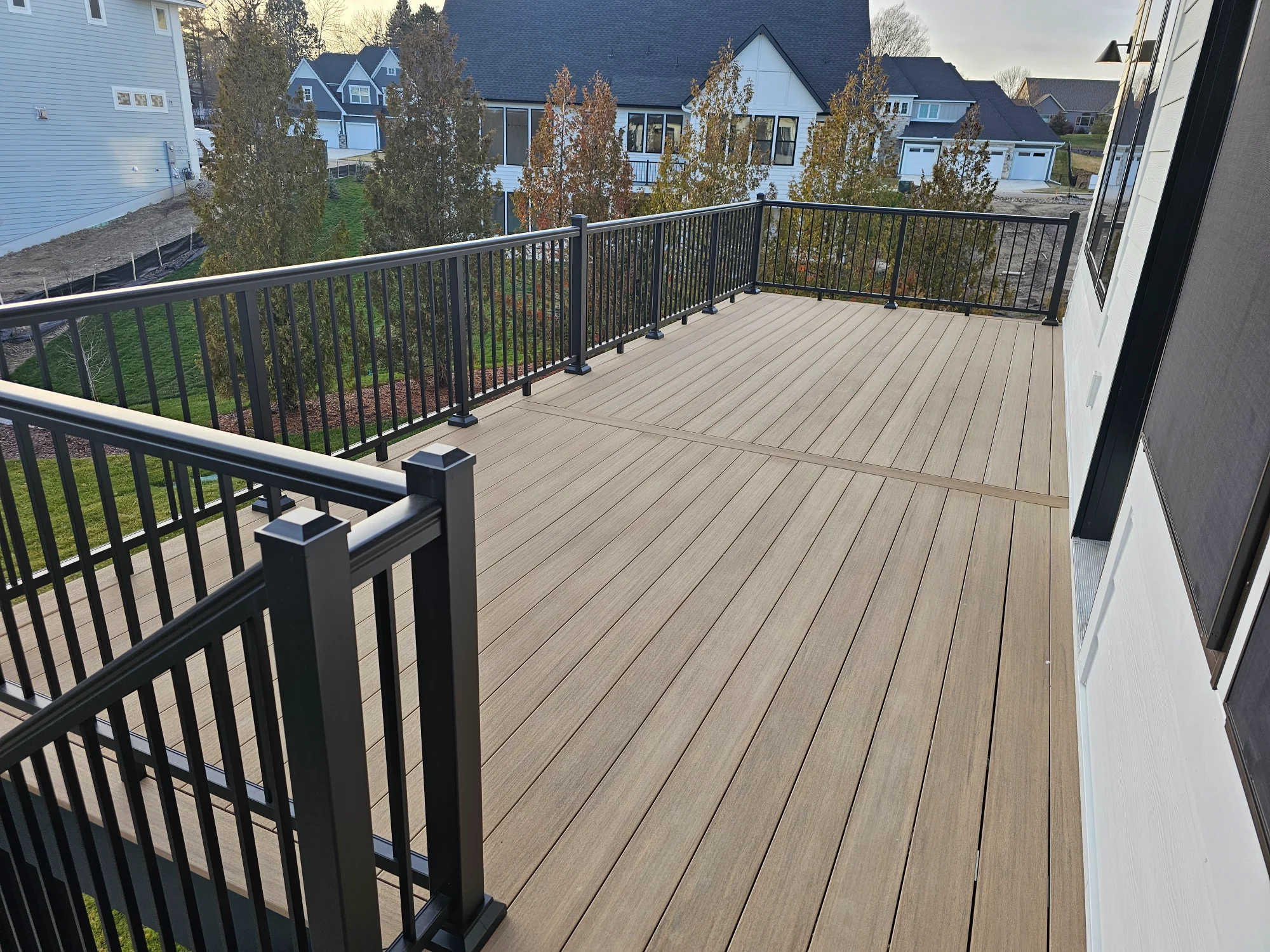 Custom deck staircase design with composite treads and aluminum railings